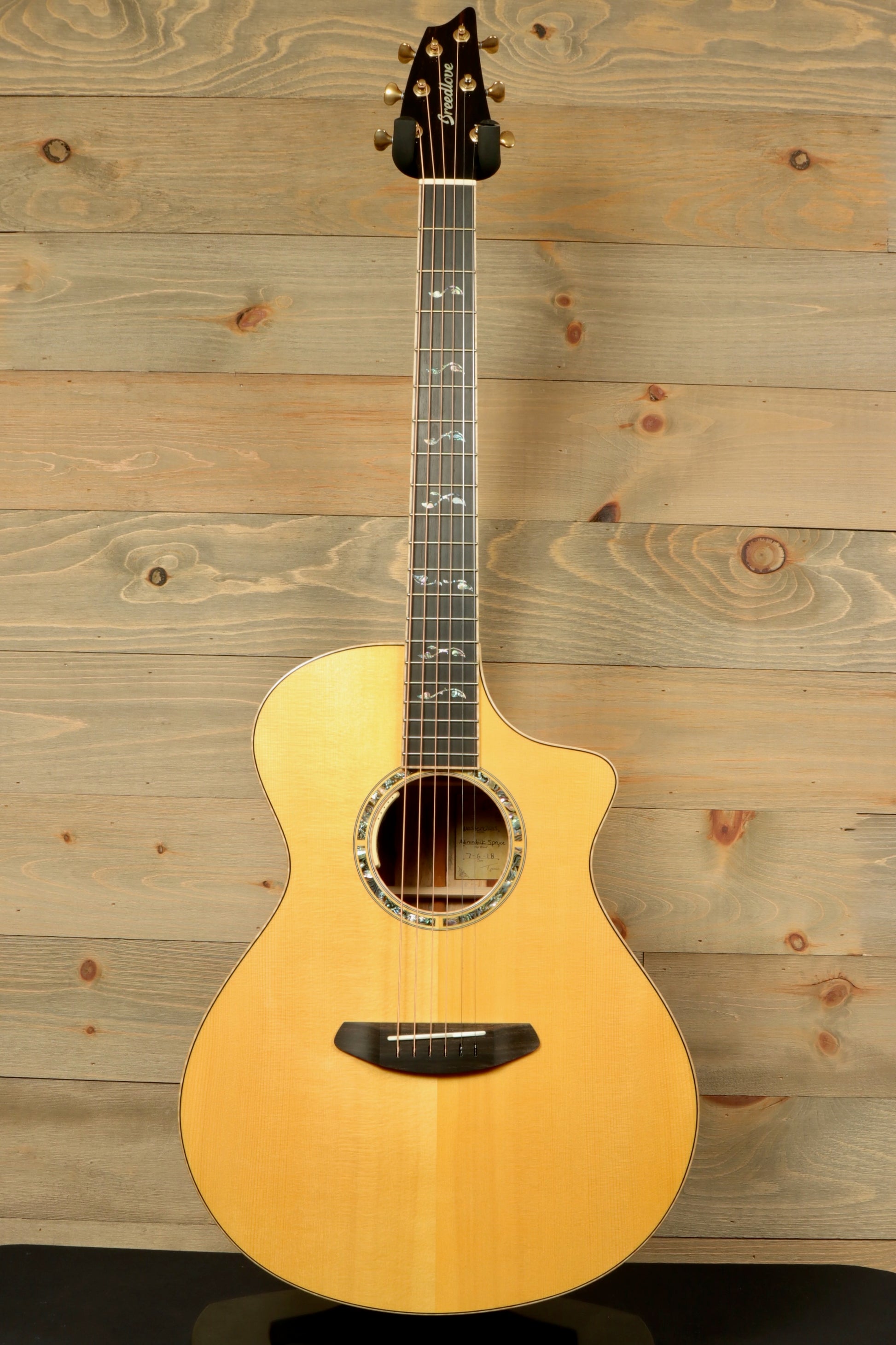 Used Breedlove Masterclass Concert guitar with a natural finish and intricate inlay details