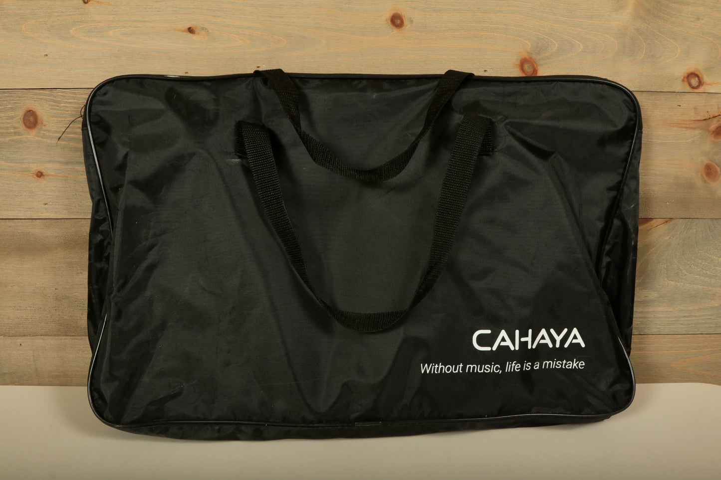 Used Vic Firth practice pad bag in black with CAHAYA logo and durable carrying handles
