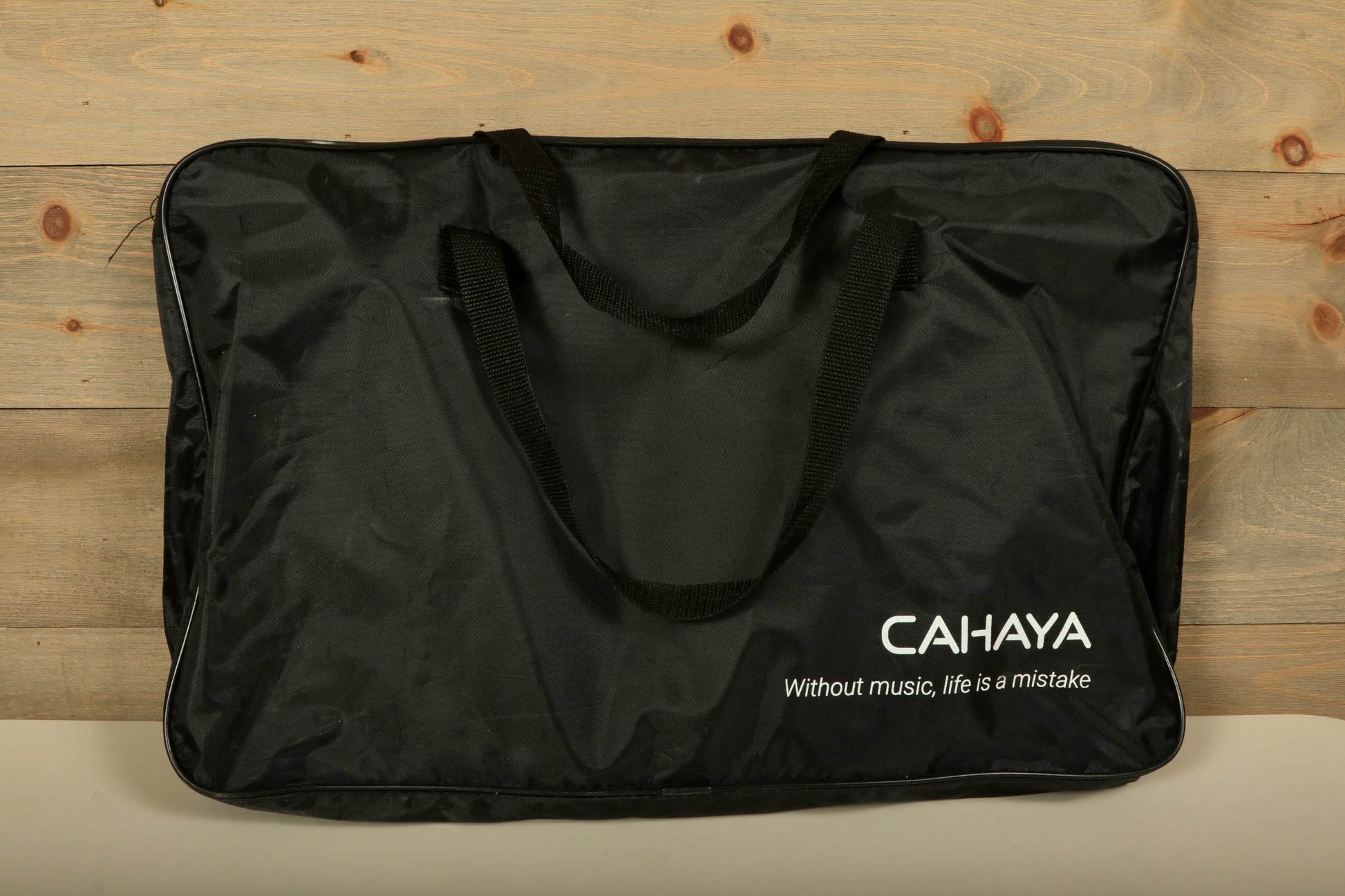 Used Vic Firth practice pad bag in black with CAHAYA logo and durable carrying handles