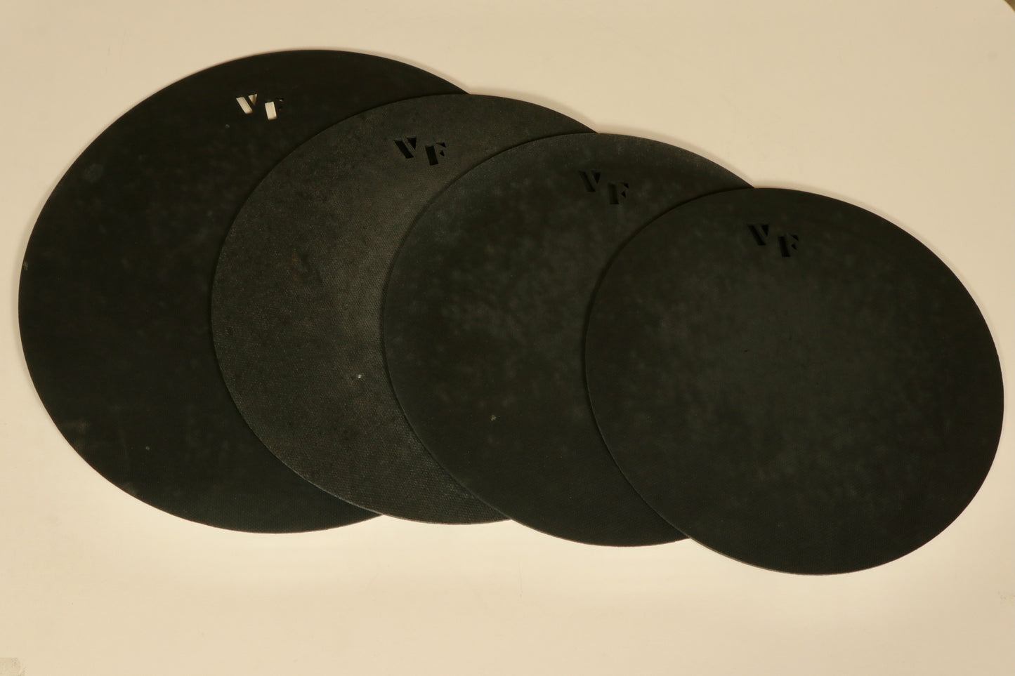 Set of four used Vic Firth practice pads in various sizes for drumming practice and skill development