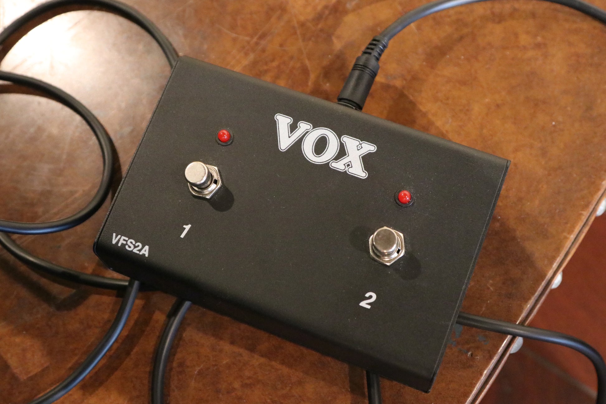 Vox AC15C2 2x12 Combo footswitch with two buttons, black finish, top view on table