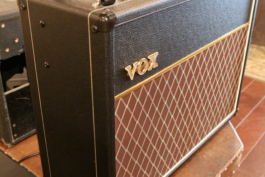 Vox AC15C2 2x12 Combo amplifier, black with classic diamond grille pattern, side view