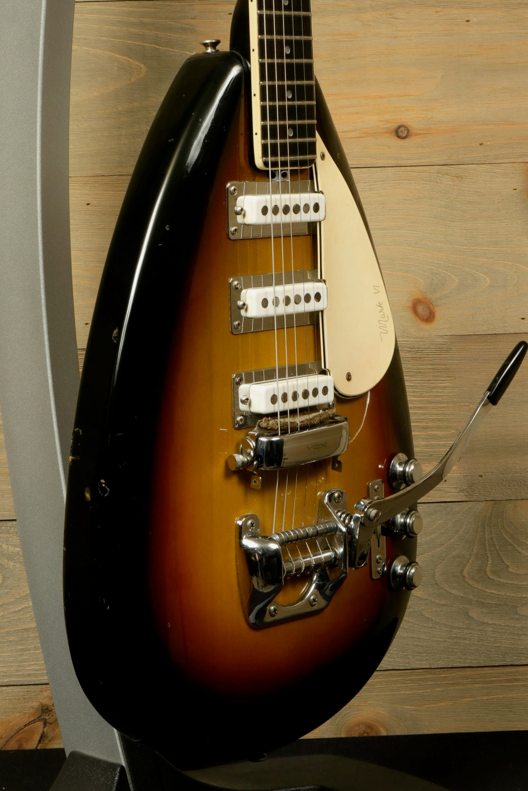 Rare Vintage Vox Guitar in sunburst finish with three pickups and tremolo bar, side view
