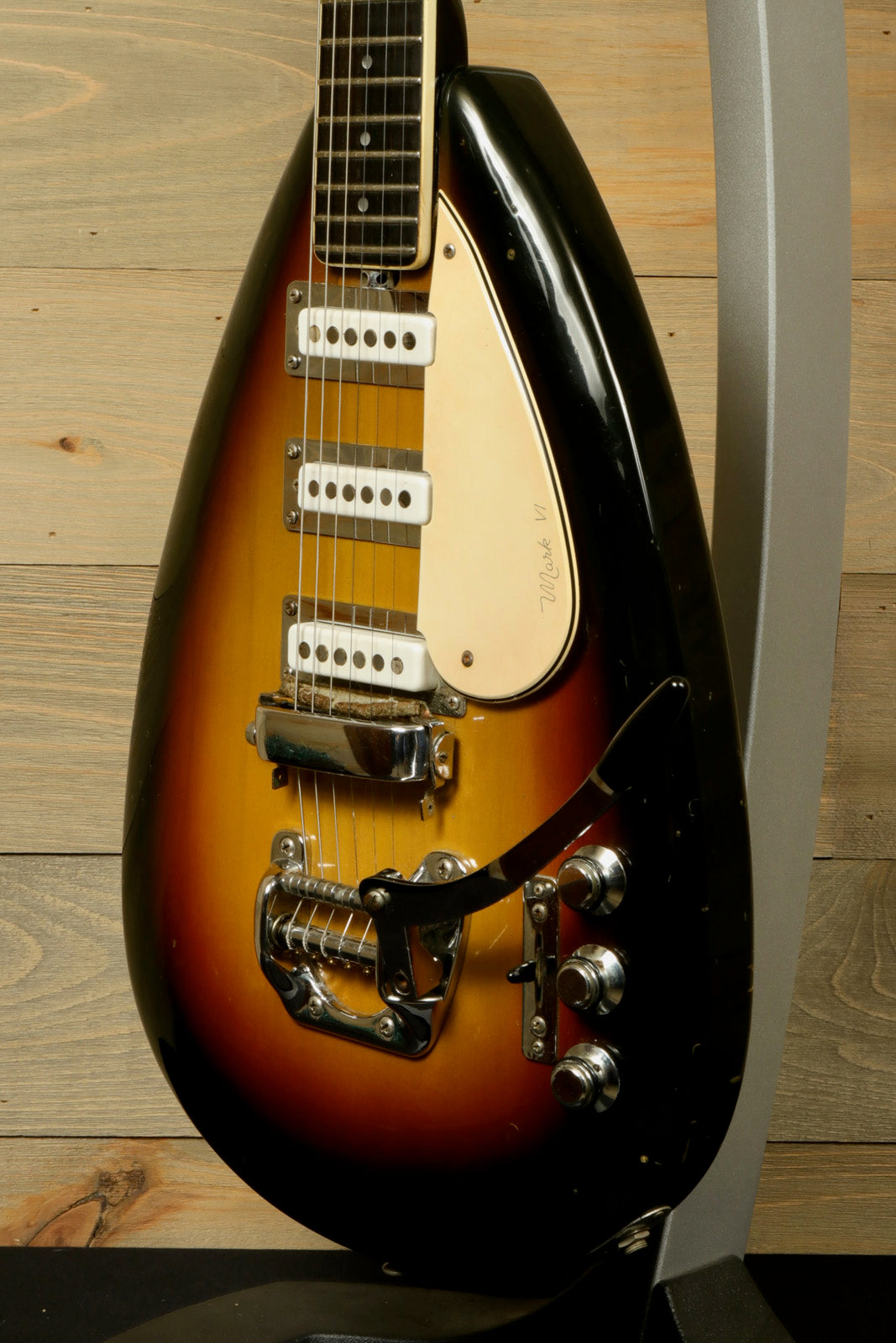Rare Vintage Vox Guitar in sunburst finish with a unique teardrop shape, angled side view