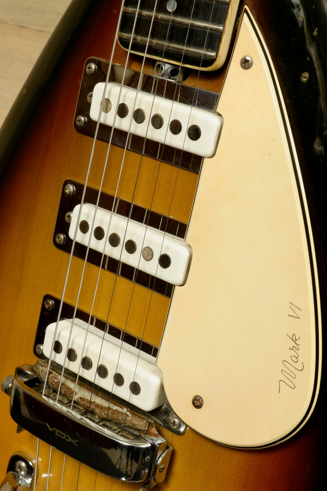 Rare Vintage Vox Guitar in sunburst finish, featuring three single-coil pickups and a Vox tremolo system, close-up view