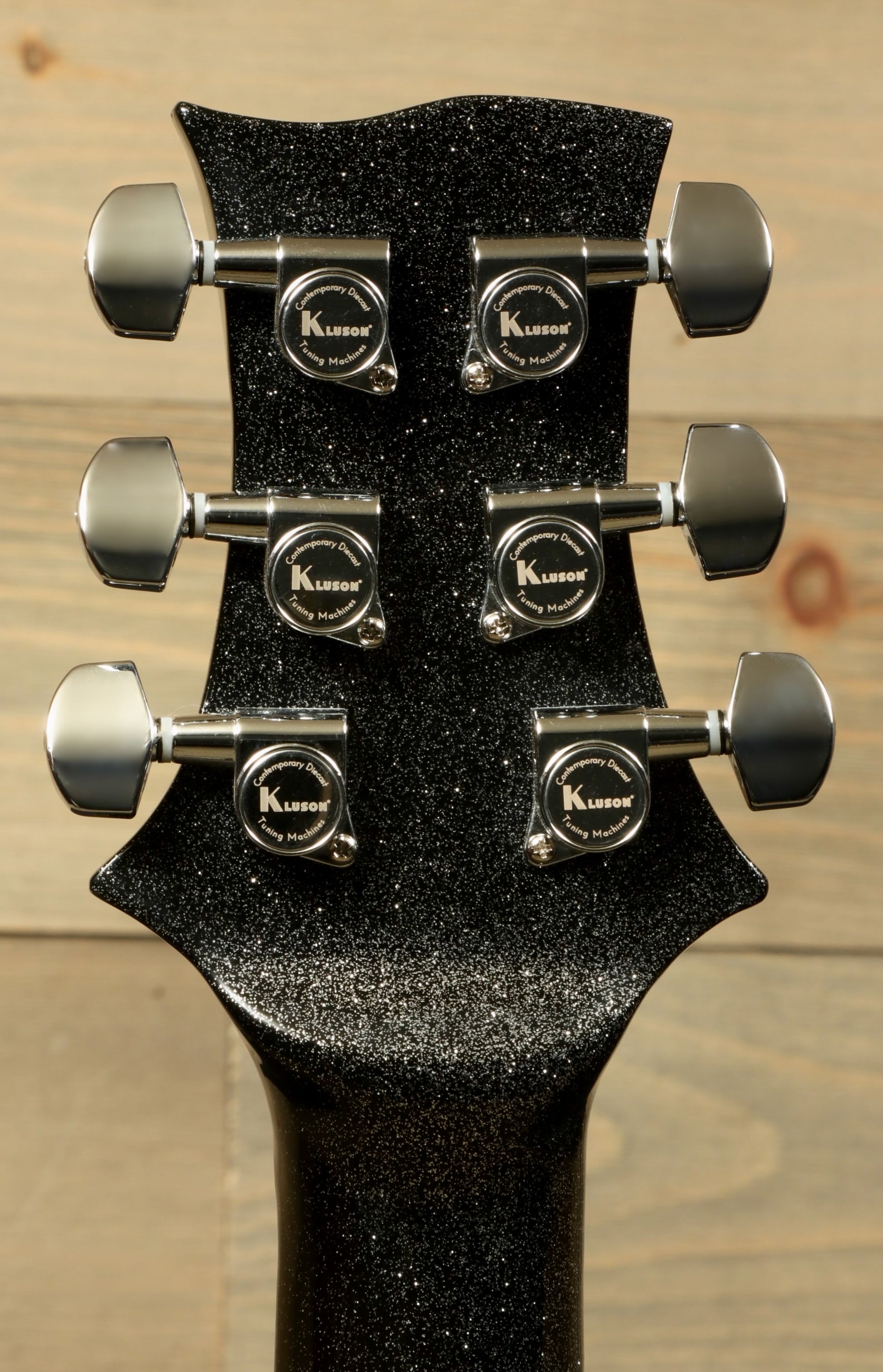 Weller Fleetwood Tremolo electric guitar headstock in black sparkle finish, rear view
