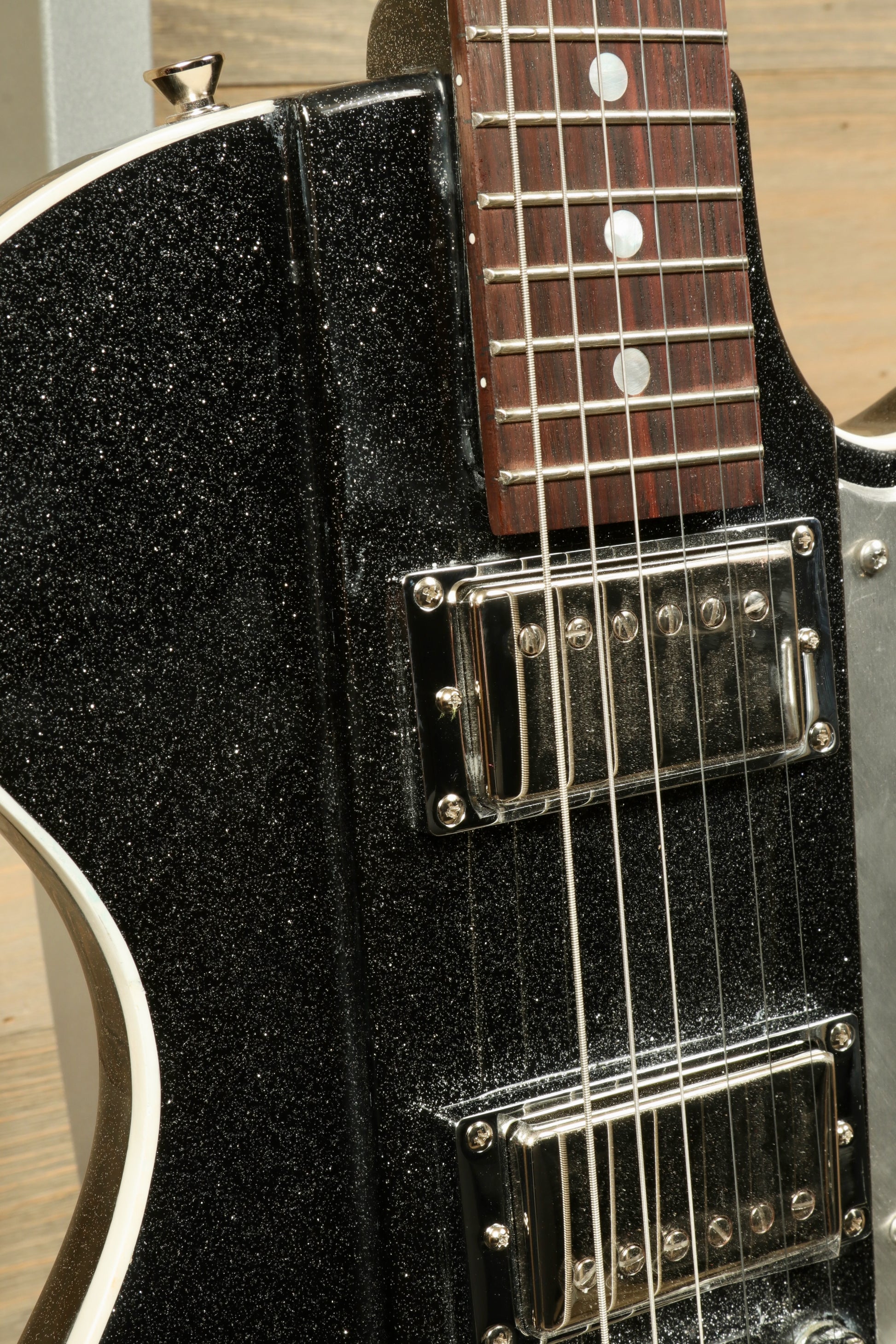 Weller Fleetwood Tremolo electric guitar with black sparkle finish, close-up view of the body and fretboard