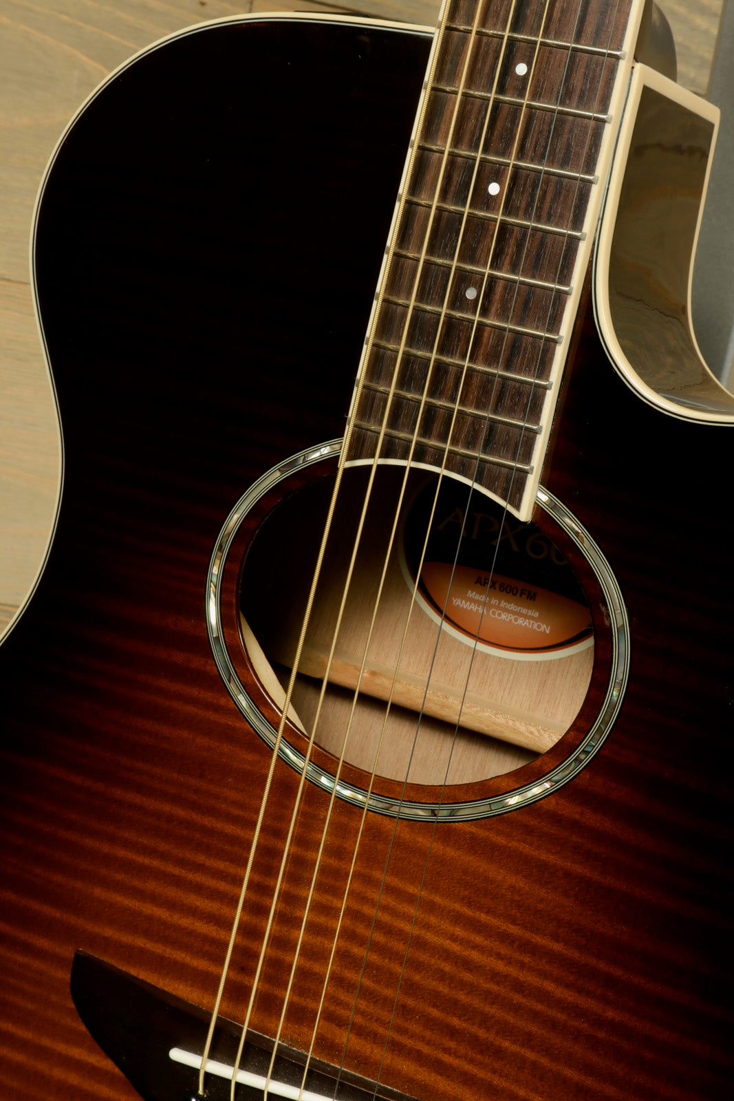 Yamaha APX600 FM acoustic electric guitar with sunburst finish, front close-up view