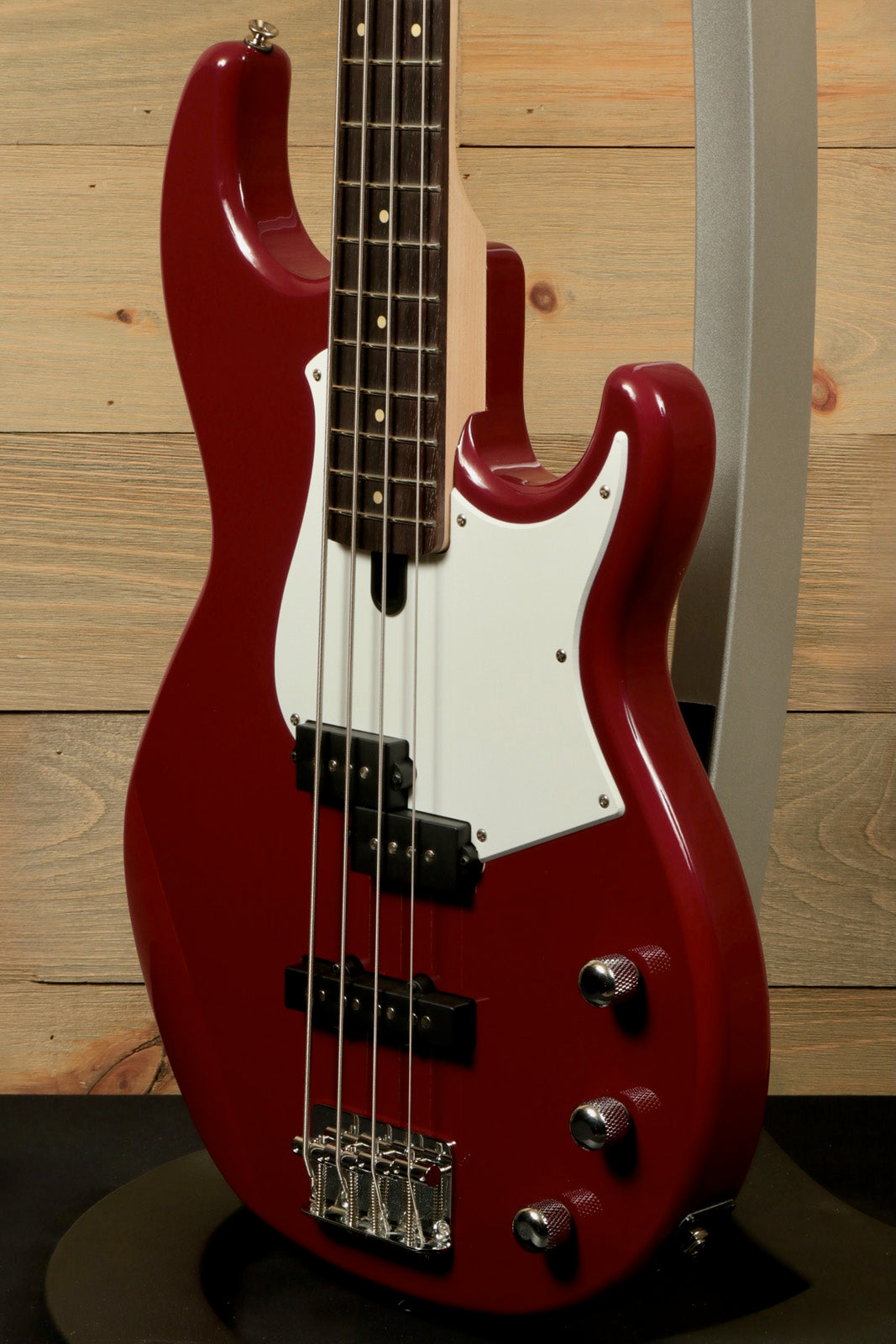 Yamaha BB234 4-String Electric Bass Guitar Raspberry Red, side view with pickguard and controls