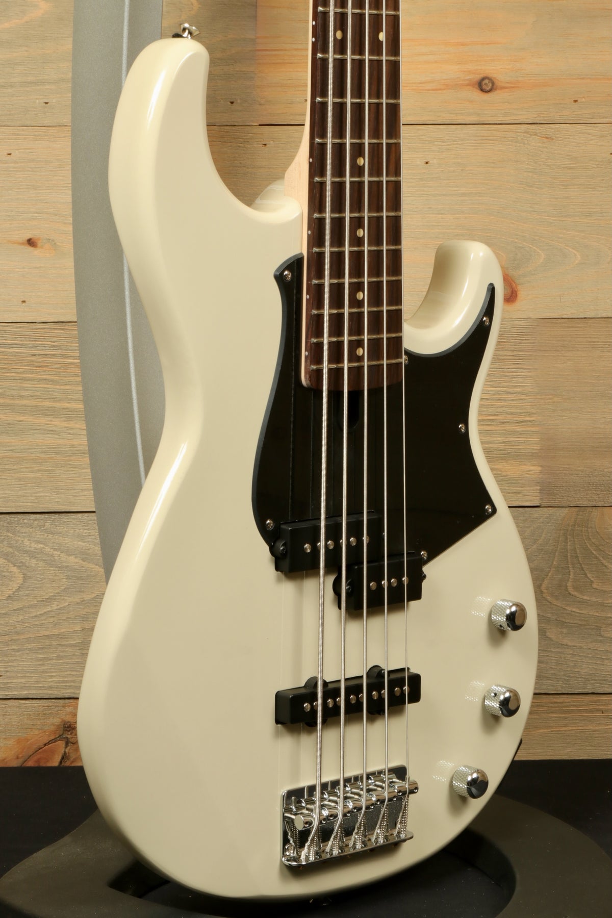 Yamaha BB235 5-String Electric Bass Guitar in cream white, side view with black pickguard