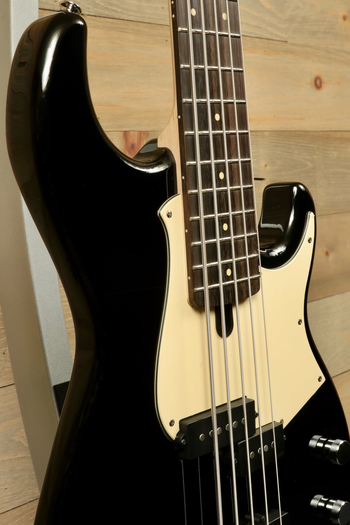 Yamaha BB435 5-String Electric Bass Guitar in black, side view showcasing the neck and body