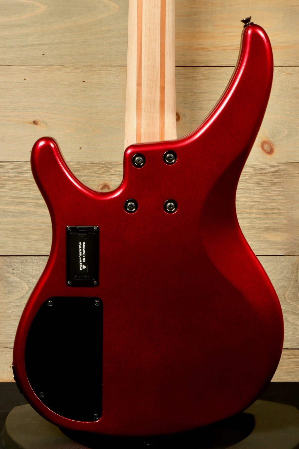 Yamaha electric bass and guitar, red finish, back view showcasing sleek design.