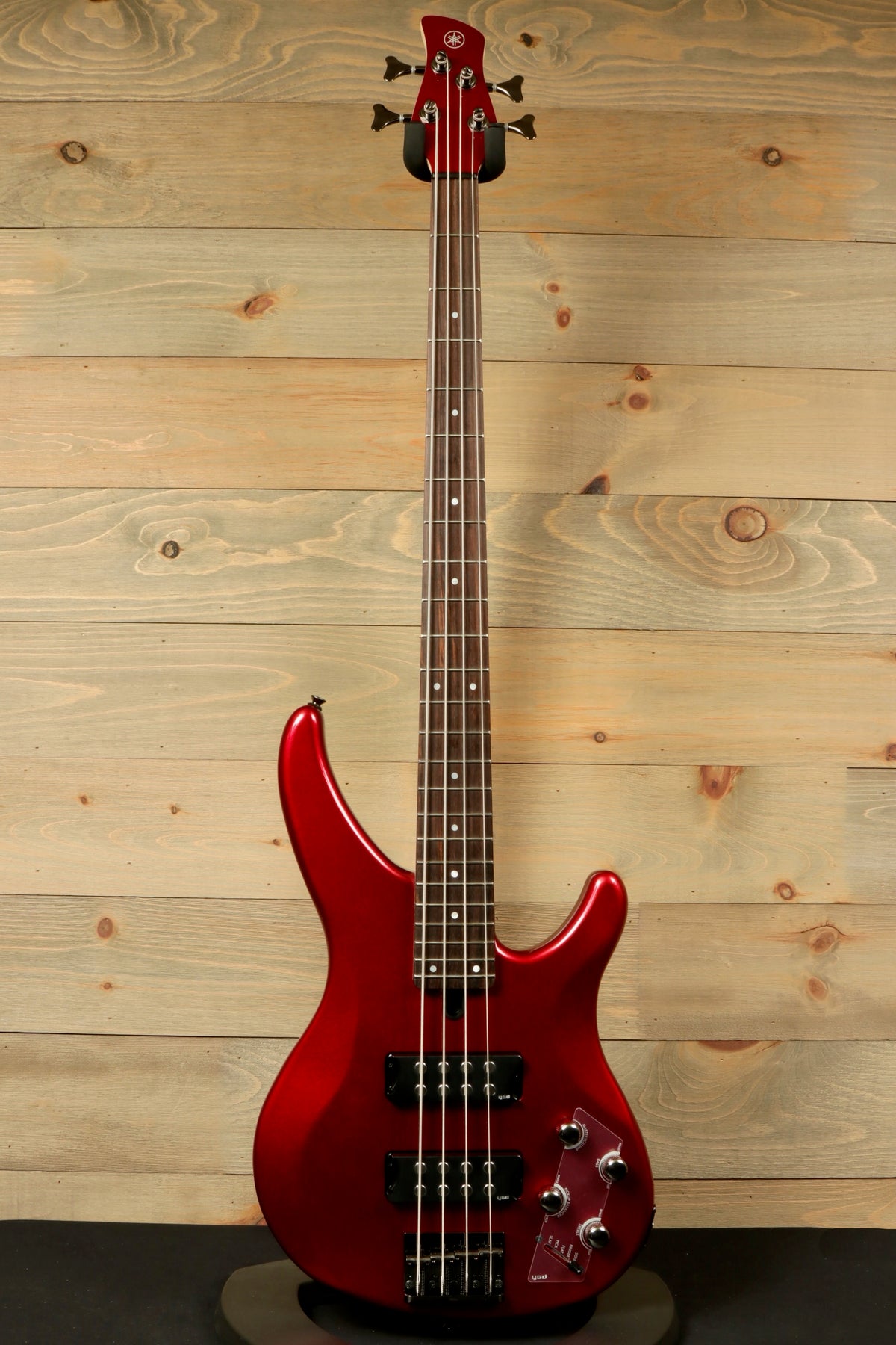 Yamaha electric bass and guitar in red finish, front view showcasing four strings and sleek design