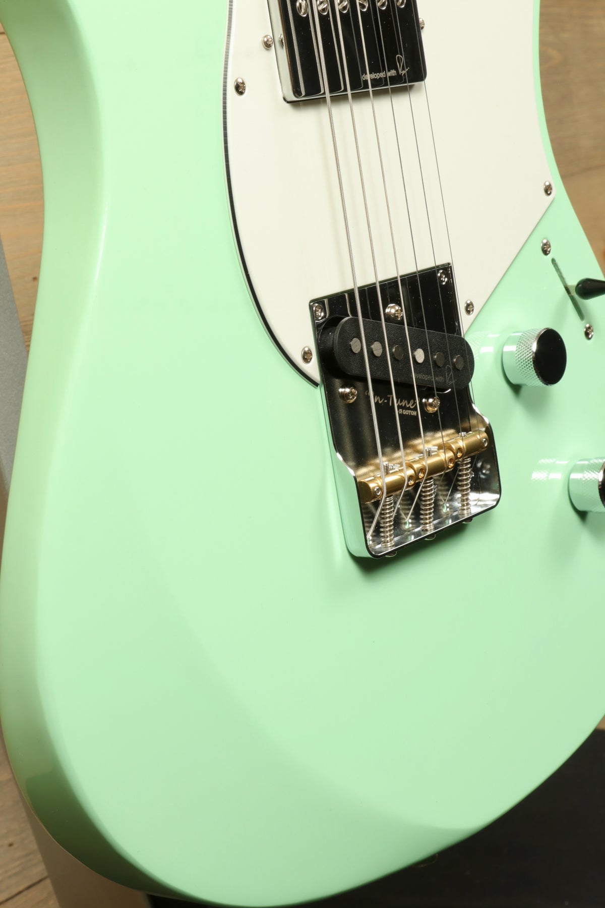 Yamaha Pacifica Peppermint Green electric guitar, close-up view of body and hardware