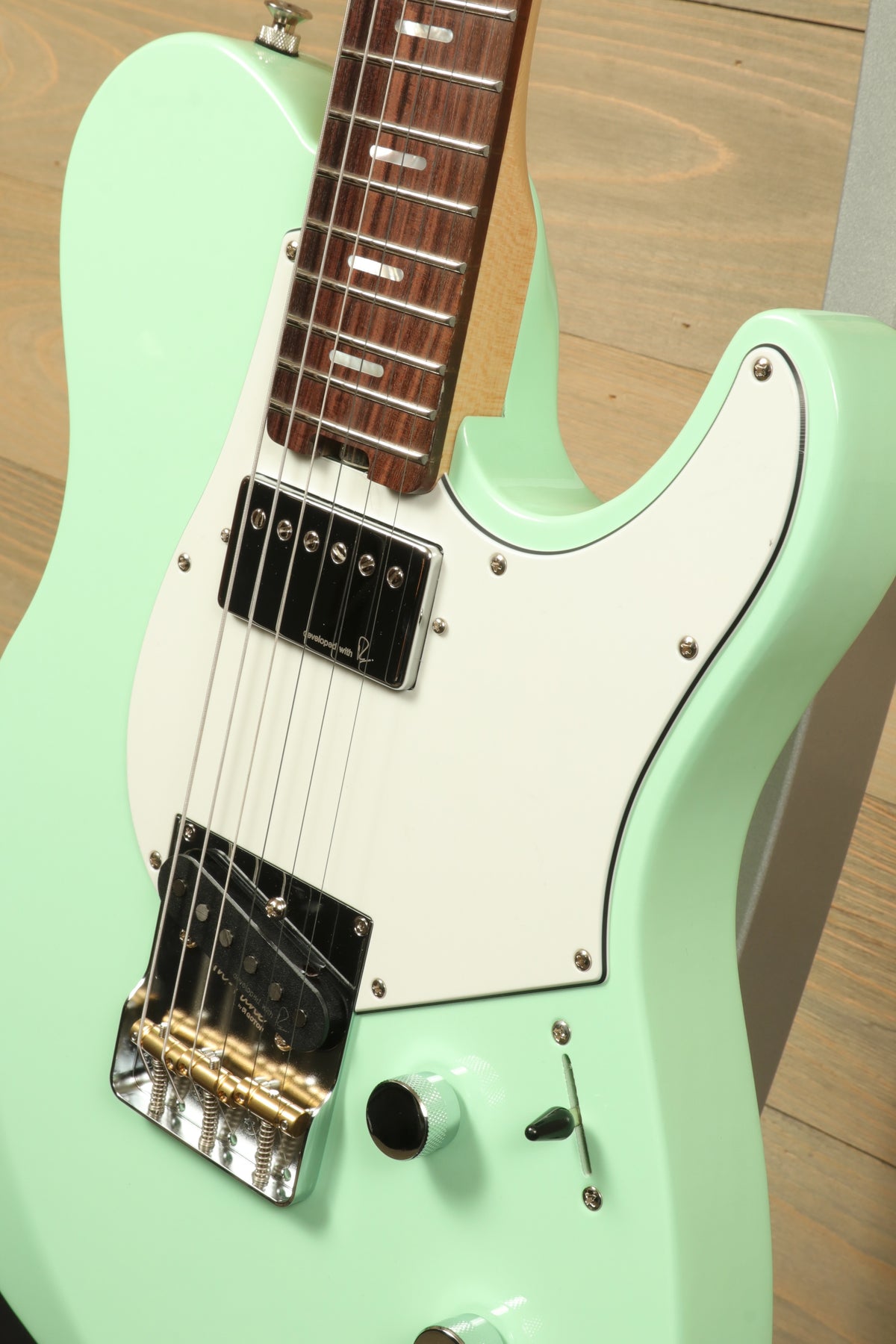 Yamaha Pacifica Peppermint Green electric guitar, close-up view showcasing design and features