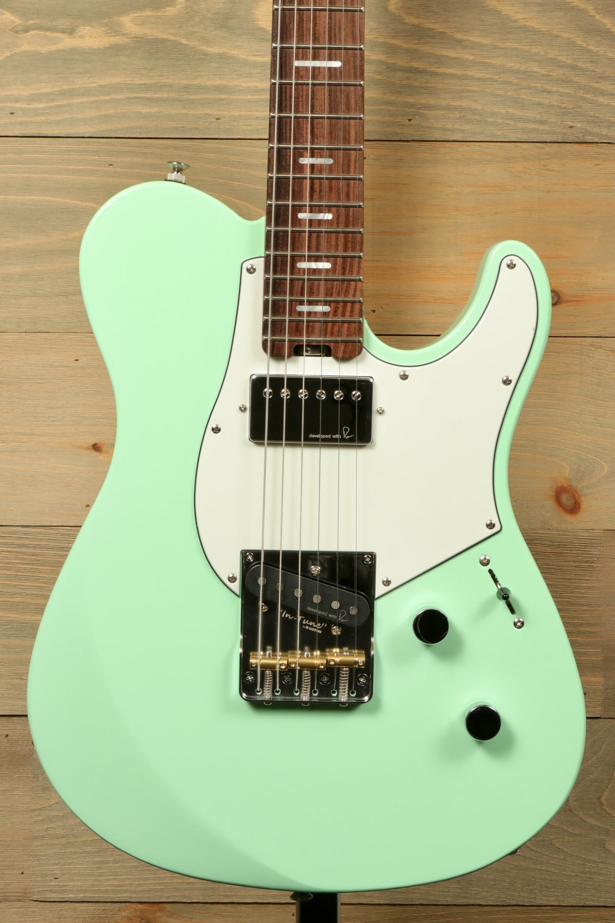 Yamaha Pacifica Peppermint Green electric guitar, front view with a sleek design and versatile features