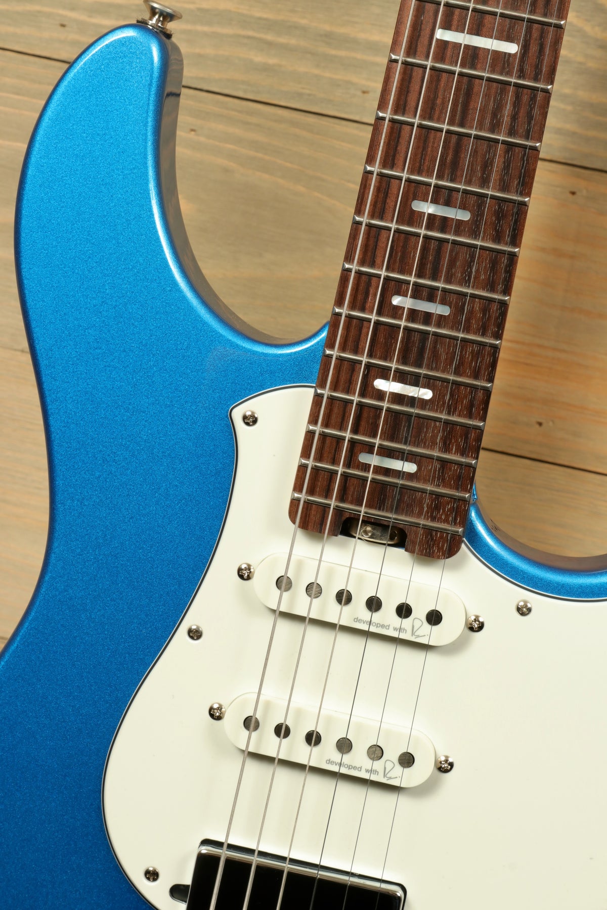 Yamaha Pacifica PACS+12 Standard Plus electric guitar in metallic blue, close-up view of body and neck