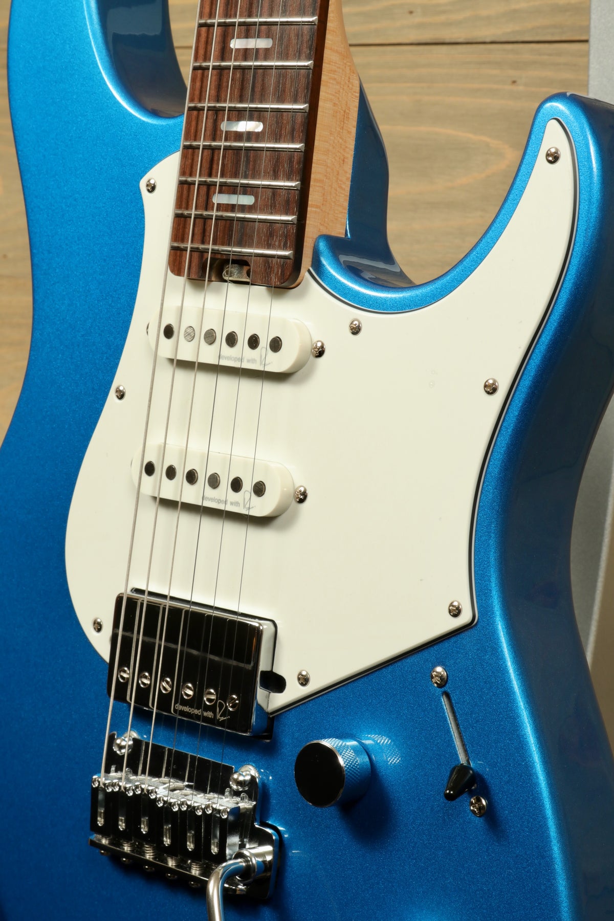 Yamaha Pacifica PACS+12 Standard Plus electric guitar in metallic blue, angled view showing pickups and fretboard