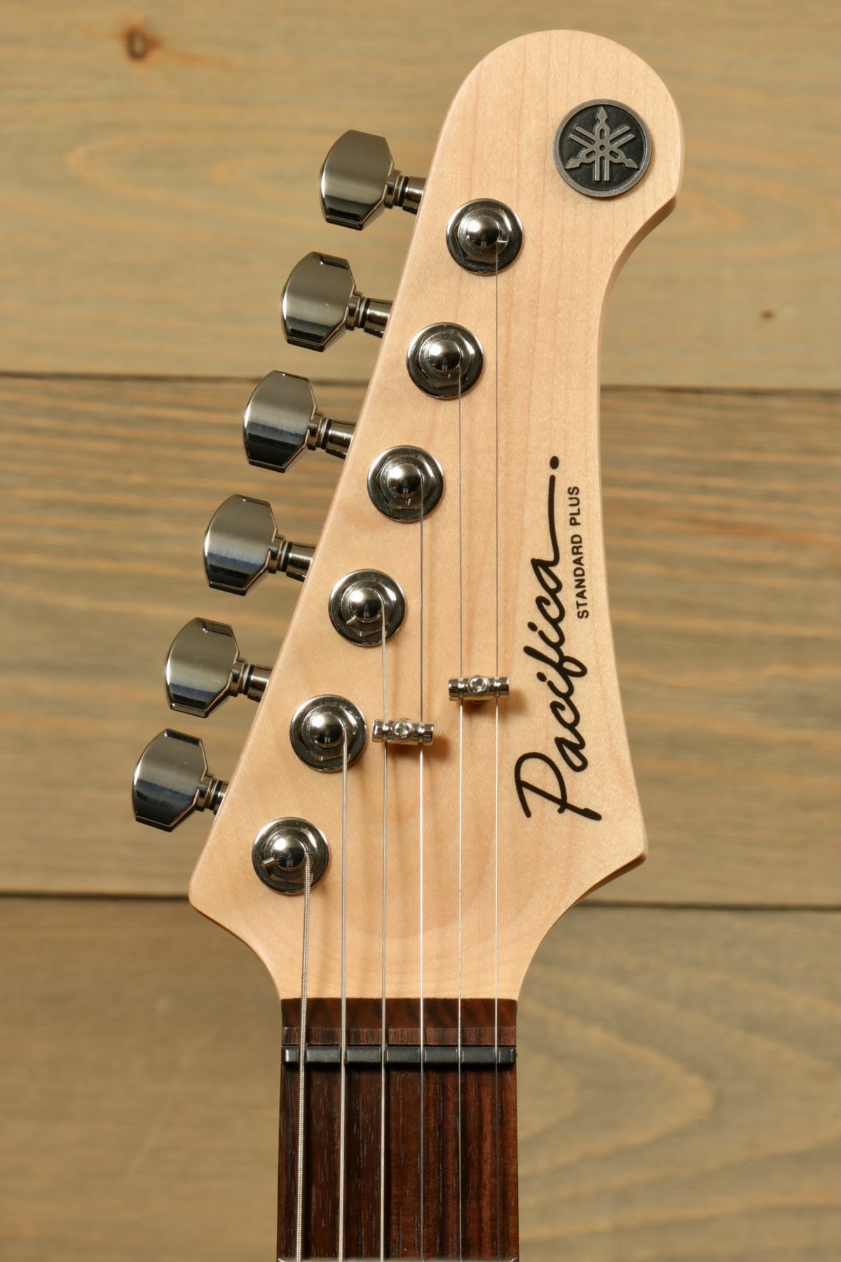 Yamaha Pacifica PACS+12 Standard Plus guitar neck in natural finish, front view with chrome tuning pegs