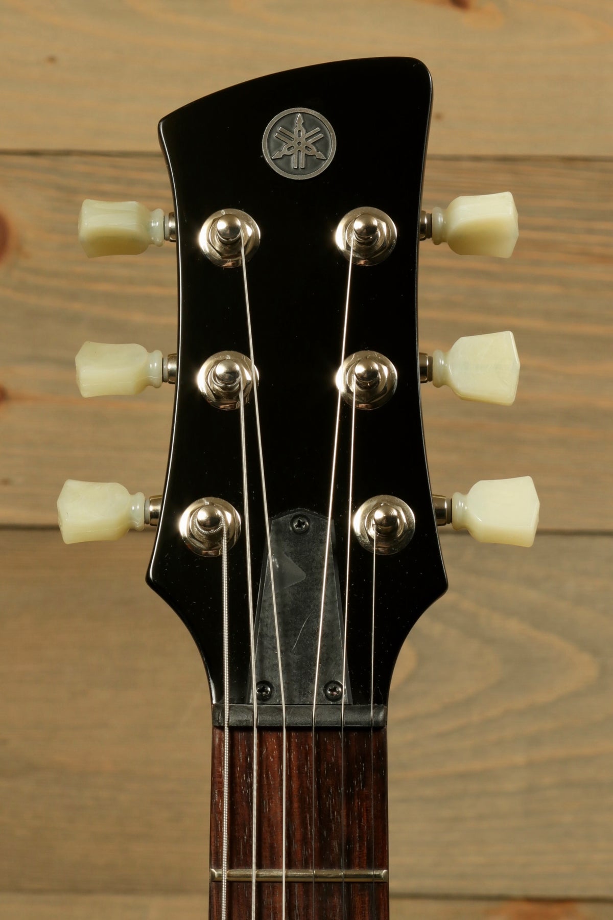 Yamaha Revstar Element RSE20 Electric Guitar Black, headstock view with tuning pegs