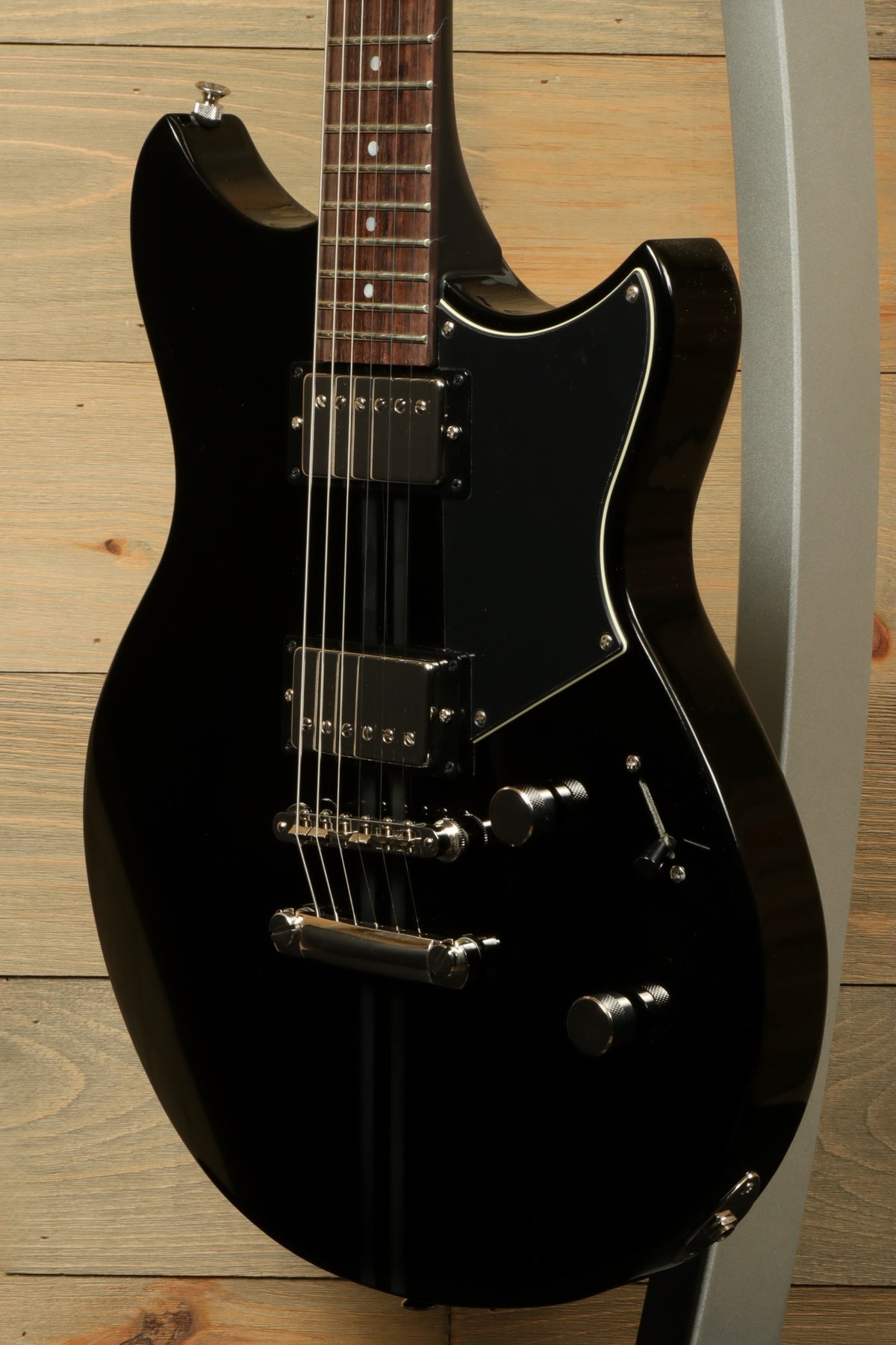 Yamaha Revstar Element RSE20 Electric Guitar Black, angled view showcasing body and hardware