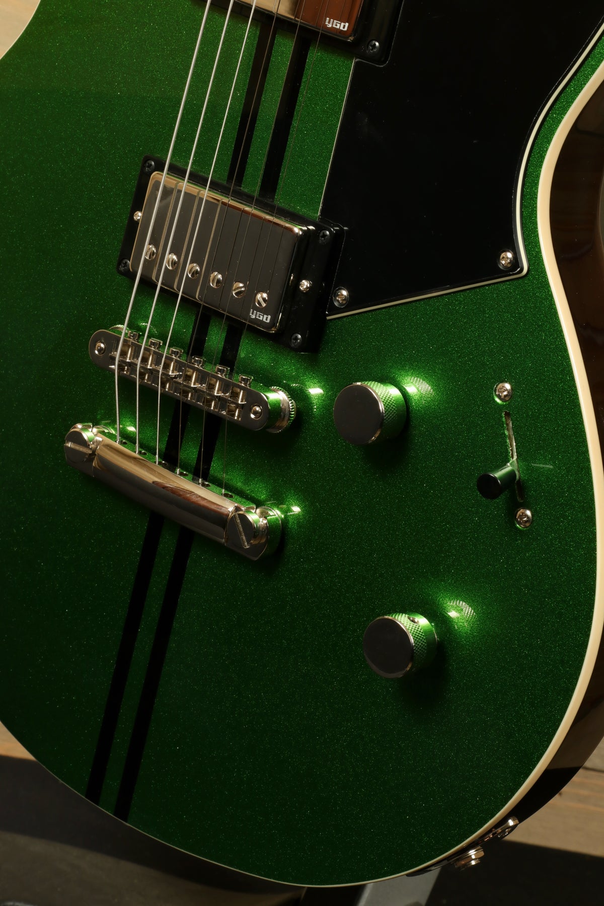 Yamaha Revstar Standard RSS20 in green glitter finish, front view showcasing pickups and control knobs