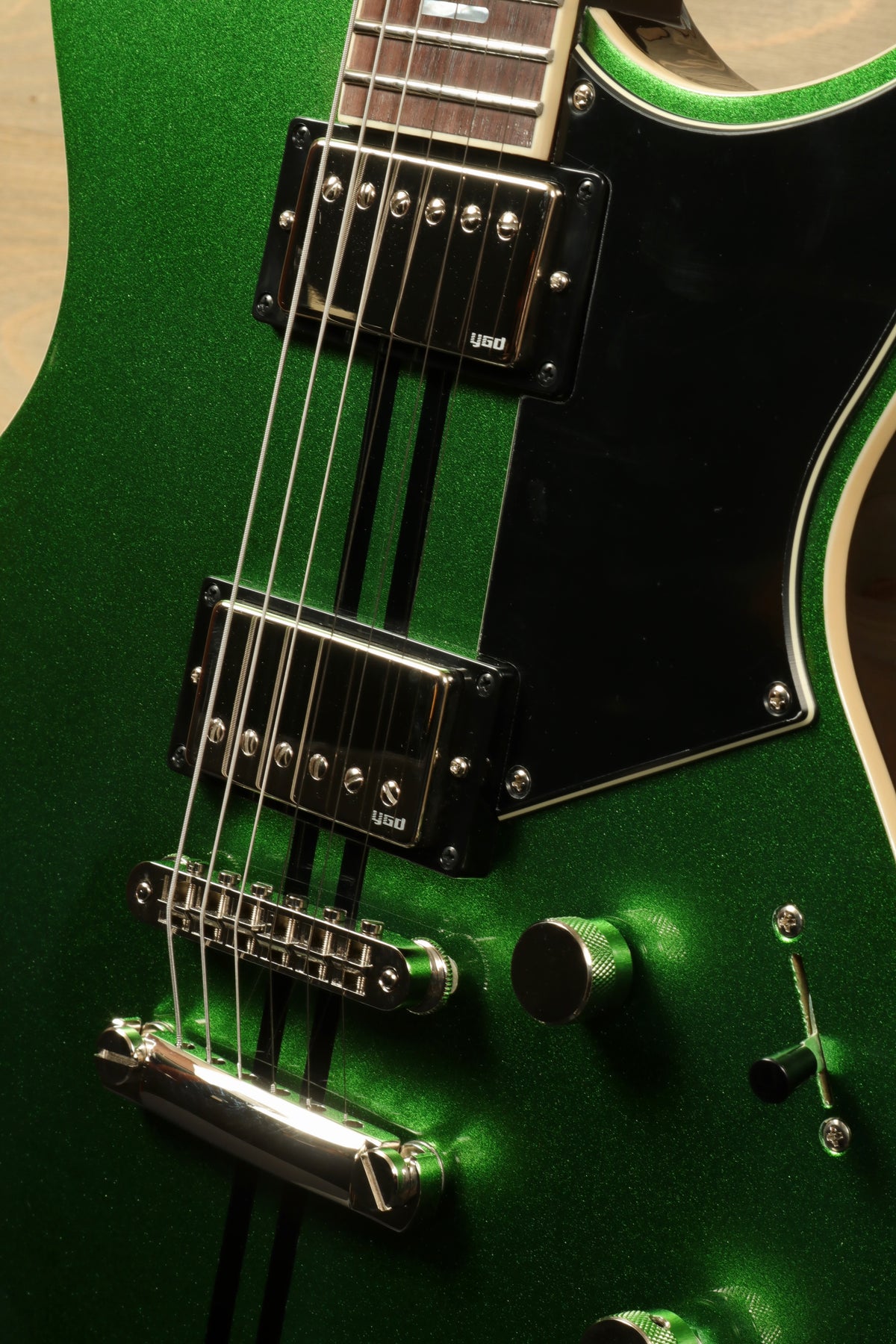 Yamaha Revstar Standard RSS20 electric guitar in metallic green, front view showcasing pickups and controls