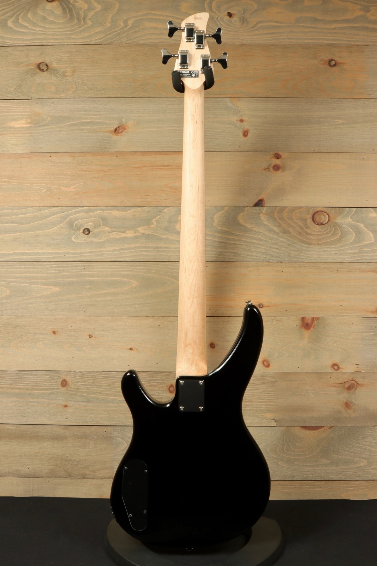 Yamaha TRBX174 black bass guitar, back view showcasing sleek design and smooth finish