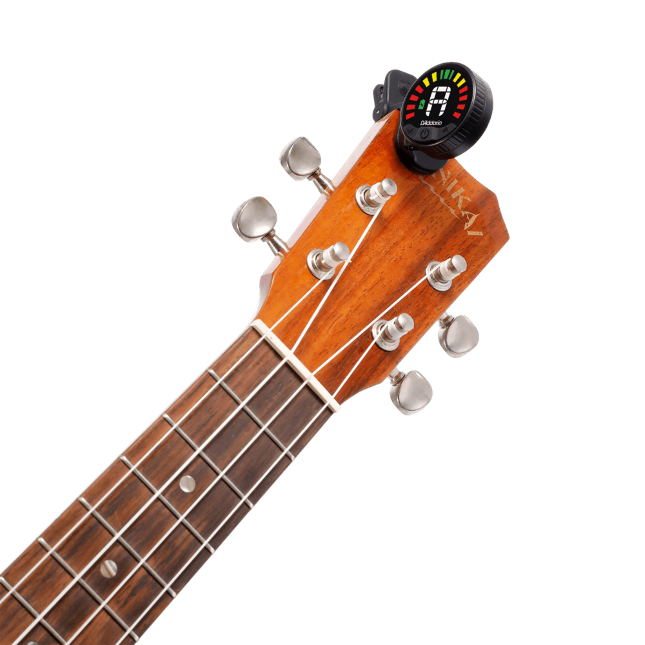 D'Addario Nexxus 360 rechargeable tuner attached to an acoustic guitar headstock for precise tuning